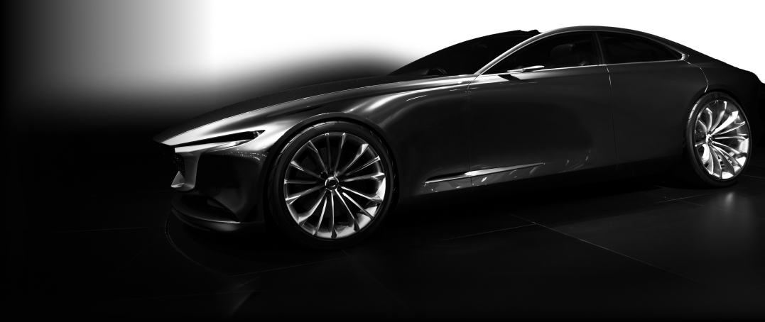 A dark car that merges into the black background